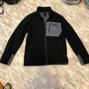 Mens black northface zip-up fleece jacket.